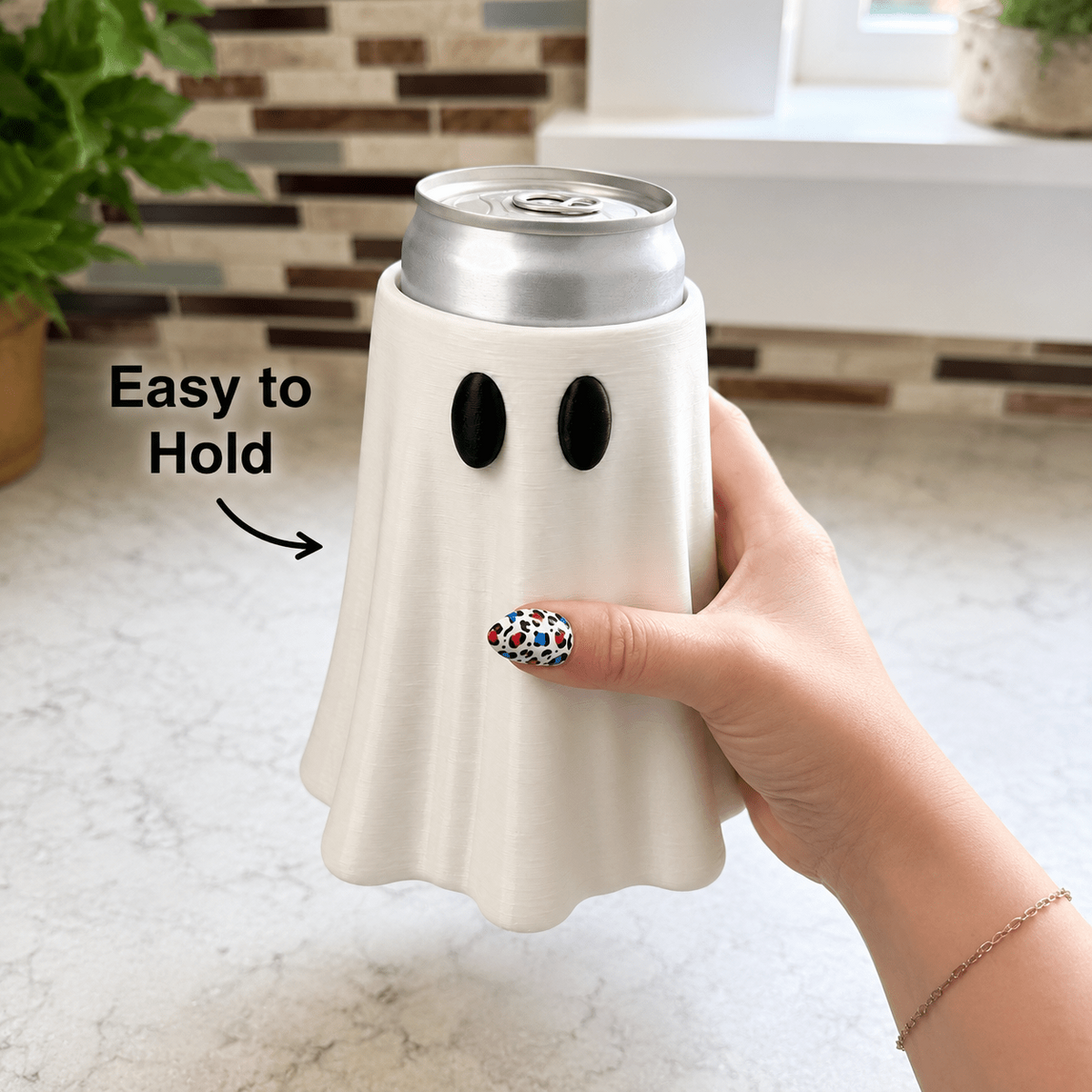 Hand holding the ghost can holder