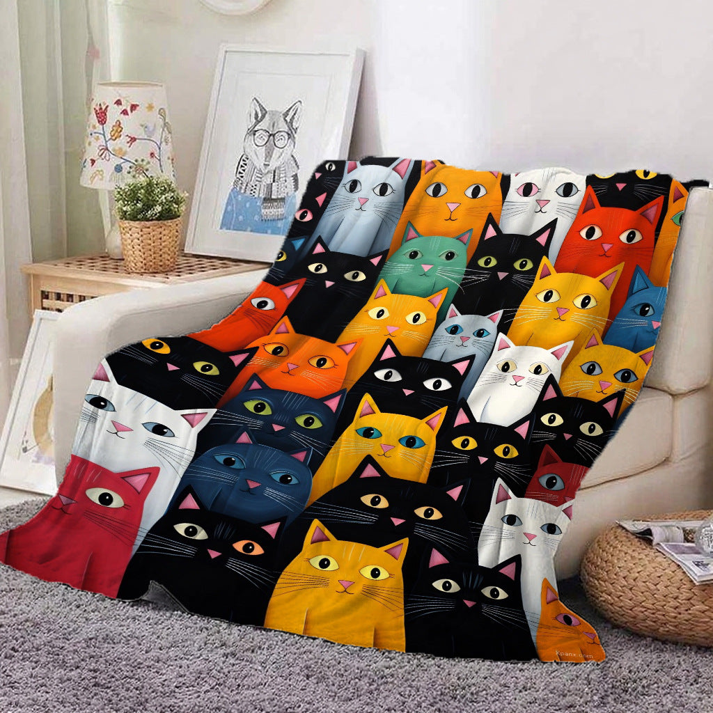 Cat Tiles print flannel throw blanket with graphic cat faces in red, orange, teal and black